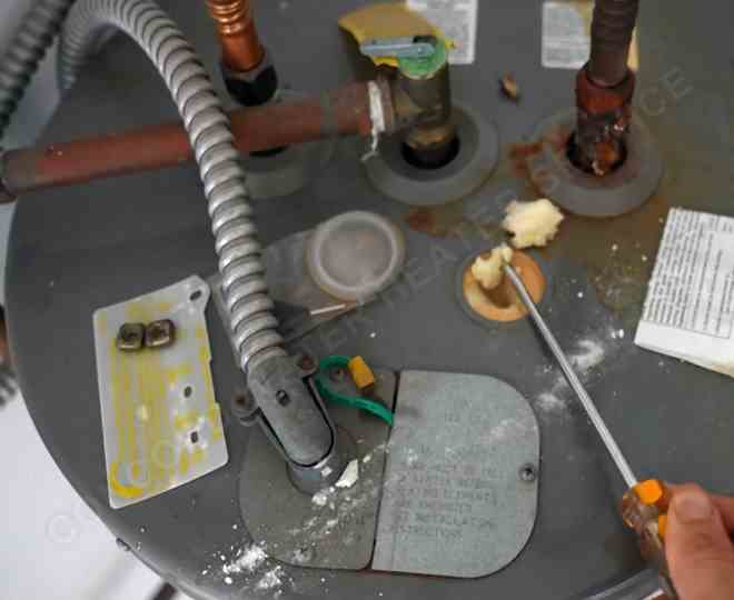 Corroded water heater connections in Concord home requiring same-day emergency leak repair