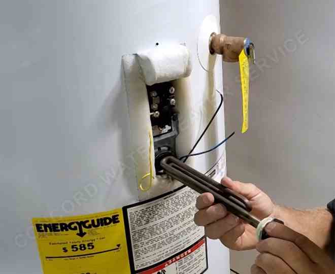Concord water heater repair technician replacing a faulty heating element.