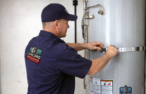 Professional water heater technician installing new unit in Pleasant Hill home